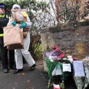A foresnics officer removes evidence from Joanna Yeates' flat
