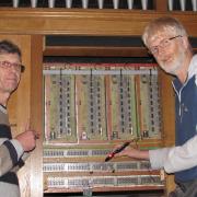 Keith Watson and Gordon Cockburn testing the electronics of the organ at St James’ by the Park church in Shirley.