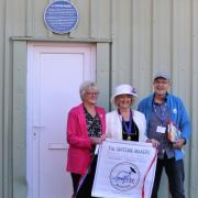 Alan Matlock (right) pictured with Glenys May (middle), daughter of Spitfire maker Claude Cox and Alderman Linda Norris (left) donor of The Spitfire Makers Charitable Trust plaque at Hollybrook Stores, Southampton.