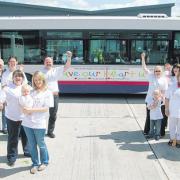 The Have A Heart campaign bus advert is unveiled at Empress Rd bus depot watched by campaign supporters.