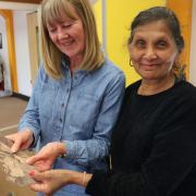 Janet and Nim at the collaging workshop, which benefited from the grant.