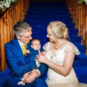 Leo and Caroline Poulter with daughter Neve on their wedding day