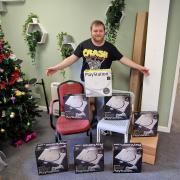 John Borg, 30, with the PlayStation boxes found