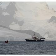 The research team approaches the research vessel Hans Hansson after a day out on the small boat, following fin whales.