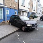 Damaged car left on pavement after crash between vehicle and three parked cars (Image: Andy Goodall)