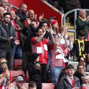 Fans pay tribute to Saints fan CJ Fenna during Stoke match at St Mary's