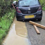 Suzanne Onslow was left shaken up after her Corsa, pictured, got stuck in a '8 inch' pothole in Burnetts Lane, Hampshire