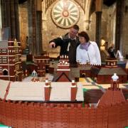 Stewart Morland and Lois Price admire a Lego model of Basing House, Great Hall, Winchester