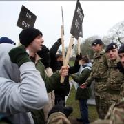 Soldiers on exercise face an angry mob