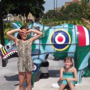 Girls strike a pose with the rhinos