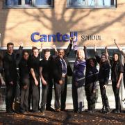 Cantell School’s deputy head Harry Kutty, head Ruth Evans and pupils celebrate their Ofsted report.