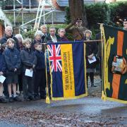 Standard bearers lower their flags in tributes to First World War heroes in Hursley