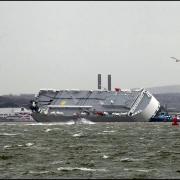 Hoegh Osaka being towed today in high tide.