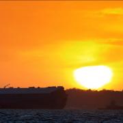 The sun sets over Hoegh Osaka last night. Picture by Robin Jones.