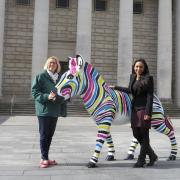 Kirstie Mathieson (left) and Councillor Satvir Kaur (right) celebrate Marwell’s Zany Zebra sponsorship.