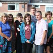 Pennie's family including her five children and husband Peter (centre, light shirt)
