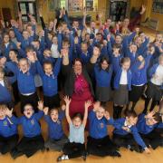 Wildground pupils and staff including headteacher Amanda Mullett celebrate the school's 'Good' Ofsted report