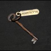 A small, corroded key for a locker on the Titanic has sold for £85,000 at auction.