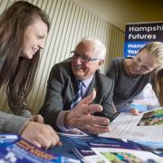 Councillor Peter Edgar, executive member for education at Hampshire County Council, talking to visitors about the range of apprenticeship and training opportunities available