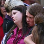 Heartbroken  mother weeps at funeral of her murdered daughters