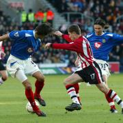 Marian Pahars scores in a previous Saints v Pompey match in 2003