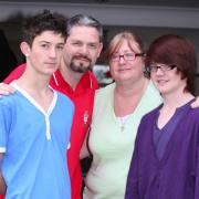 TRANSFERRED: Peter and Marie Slade with their sons Liam, left, and Jack who have been taken out of the Oasis Academy.