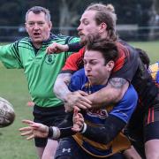 Romsey's Rob Stent is tackled (Photo by Terry Jamieson)