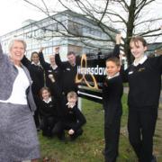 TOP OF THE CLASS! Pupils from Hounsdown School celebrate their excellent Ofsted results with head teacher Di Nightingale.