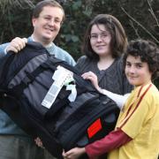 David Bennett with his children Francoise and Remi and the kitbag which was sent to Afganistan by mistake.
