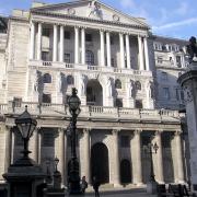 Bank of England slashes rate to record low of  half a per cent
