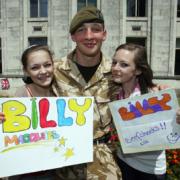 WELCOME HOME: Becky and Jess Skelton greet Billy Macguire.                Echo picture by Paul Collins. Order no: 8885776