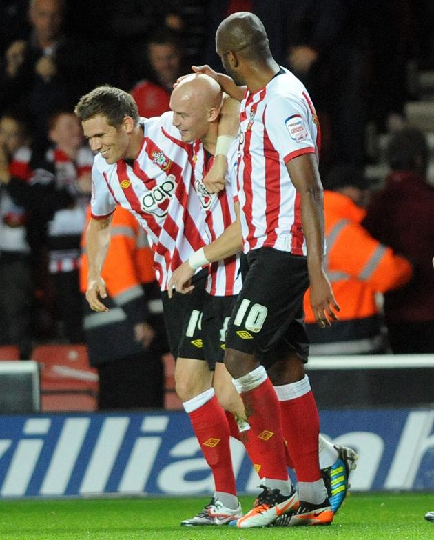 Richard Chaplow is congratulated by Dean Hammond and Guly do Prado.