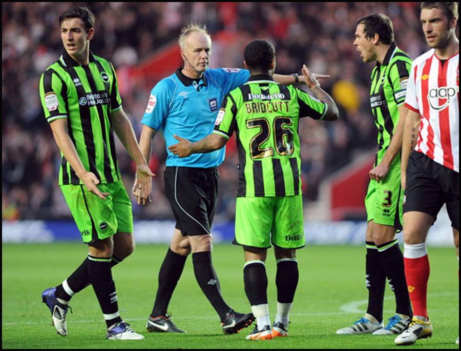 Saints v Brighton and Hove Albion, Brighton players argue with the referee.