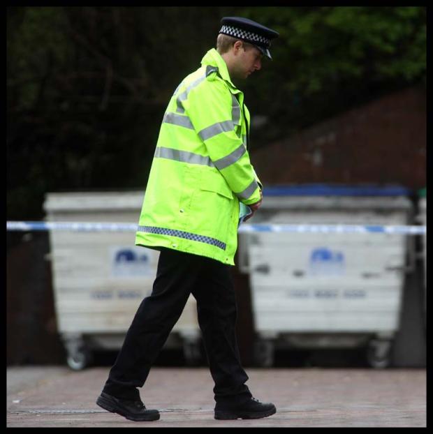 Police at Empress Road where Jamie Dack's body was discovered in a bin