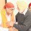 Armajit Singh, left, Sardar Harnam Singh Roudh's grandson, at one of the services.