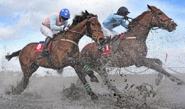 The field races through the water feature in the Kildare Hunt Club Fr Sean Breen Memorial Chase for the Ladies Perpetual Cup during the Boylesports Day at the 2013 Festival at Punchestown Racecourse, Co Kildare, Ireland.
Picture date: Tuesday April 23, 2