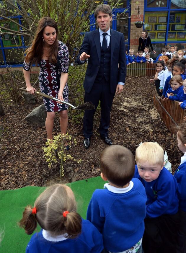 The Duchess of Cambridge plants a willow tree with comedian John Bishop at The Willows Primary School, Wythenshawe, Manchester where she launched a new school counselling programme to help combat the effects of drug and alcohol addiction.
Picture date: T