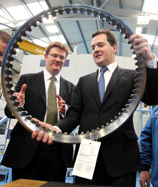 The Chancellor of the Exchequer George Osborne and Chief Secretary to the Treasury Danny Alexander during a visit to the CNC milling section at Castle Precision Engineering in Glasgow after the launch of the Scotland Analysis paper on Currency and Monetar