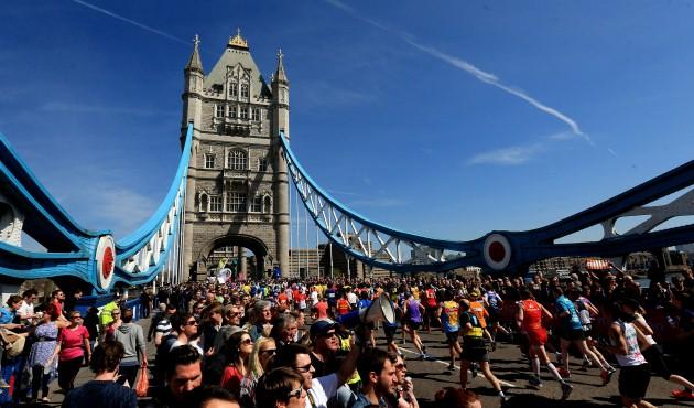 Spectators watch as runners cross Tower Bridge during the Virgin London Marathon in London.
Picture date: Sunday April 21, 2013.