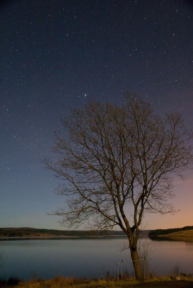  Stars in the night sky above Kielder Water, Northumberland.
Picture date: Saturday April 20, 2013. Kielder Water and Forest Park is a haven for wildlife and is home to northern EuropeâÂÂs largest man-made lake and England's largest forest.