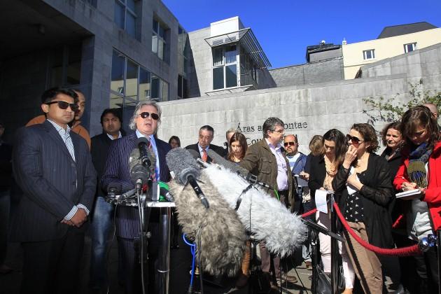 Husband Praveen Halappanavar (left) makes a statement to the media with his solicitor Gerard O'Donnell (2nd left) outside Galway County Hall after the jury in his wife Savita Halappanavar's inquest returned a unanimous verdict of death by medical misadven
