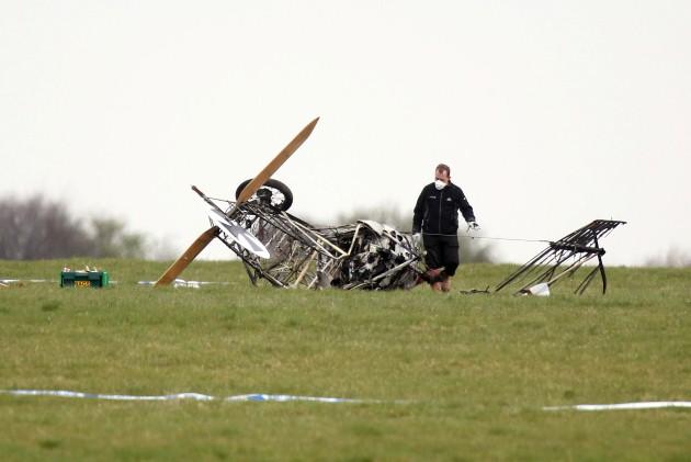 Investigators work on the wreckage of the civilian light aircraft at the Army Aviation Centre in Middle Wallop, Hampshire.
Picture date: Sunday April 28, 2013. The pilot who was the only occupant of the aircraft was pronounced dead at the scene.