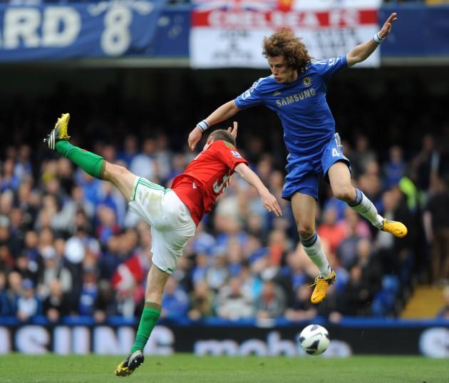 Chelsea's David Luiz (right) and Swansea's Ben Davies during the Barclays Premier League match at Stamford Bridge, London.
Picture date: Sunday April 28, 2013. 