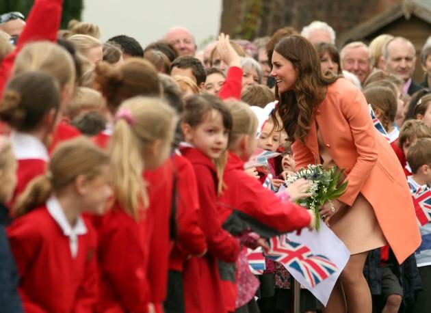 The Duchess of Cambridge meets local School children as she leaves Naomi House Children's Hospice in Winchester, Hampshire, following her visit during Children's Hospice Week.
Picture date: Monday April 29, 2013.