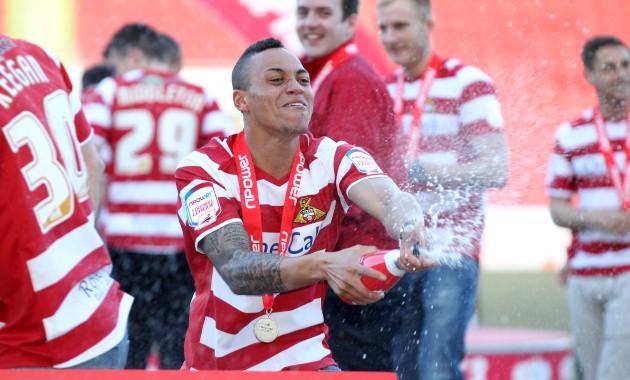 Doncaster Rovers' Kyle Bennett during the celebrations at the Keepmoat Stadium, Doncaster.
Picture date: Monday April 29, 2013.