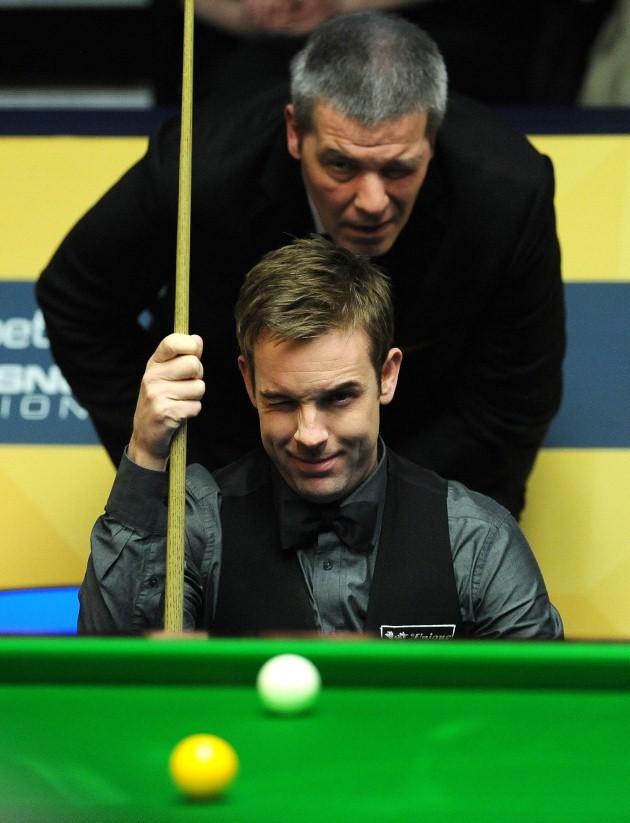 Ali Carter and referee Jan Verhaas study the table in his second round match against Ronnie O'Sullivan during the Betfair World Championships at the Crucible, Sheffield.
Picture date: Monday April 29, 2013.