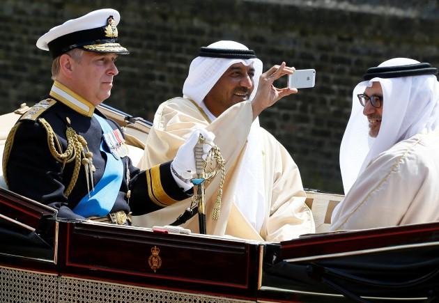 The Duke of York rides in a carriage with Sheik Ahmed bin Saeed Al Maktoum, President of the Department of Civil Aviation in Dubai and Dr Anwar Mohammad Gargash, Minister of State for Foreign Affairs in Windsor Castle as the President of the United Arab E