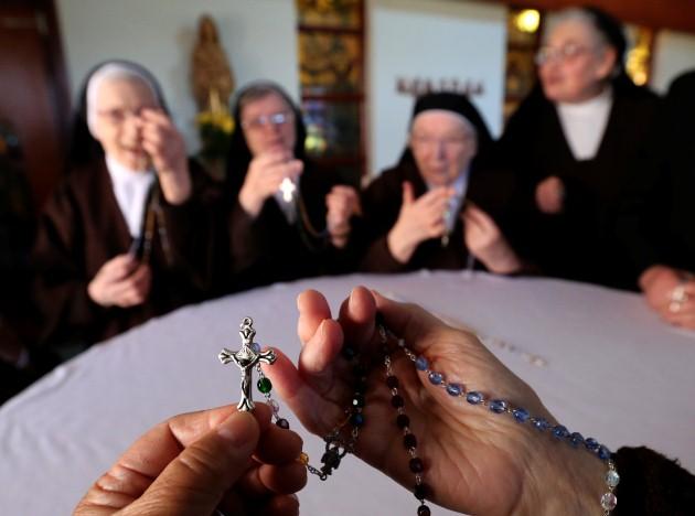Carmelite Sisters hold rosary beads at the Carmelite Monastery in Dumbarton join a Scottish based rosary campaign to pray for worldwide missions.
Picture date: Tuesday April 30, 2013. Archbishop Philip Tartaglia presented the special missionary rosaries 
