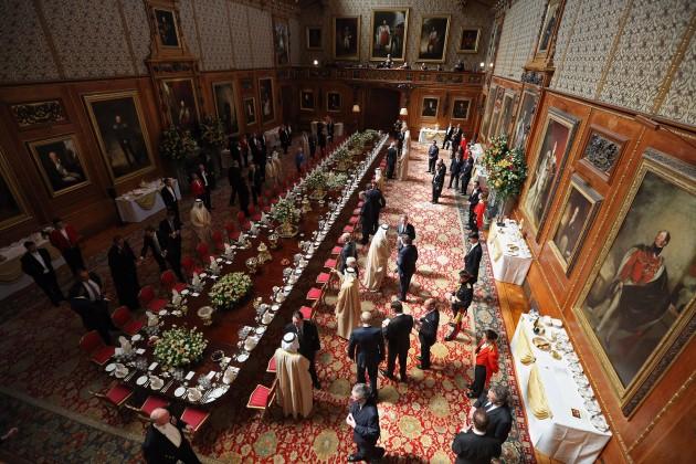 Guests take their seats for a State Luncheon for The President of the United Arab Emirates, Sheikh Khalifa bin Zayed Al Nahyan, in the Waterloo Chamber of Windsor Castle as he begins a State Visit to the UK.
Picture date: Tuesday April 30, 2013.