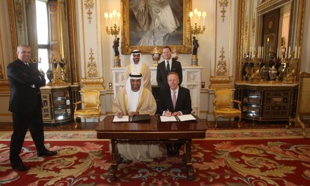 The Duke of York looks on as (front left to right) Dr Sultan Ahmed Al Jaber - Minster of State and Masdar City CEO and the UK Green Investment Bank plc CEO Shaun Kingsbury sign a Memorandum of Understanding to explore project investment opportunities in t